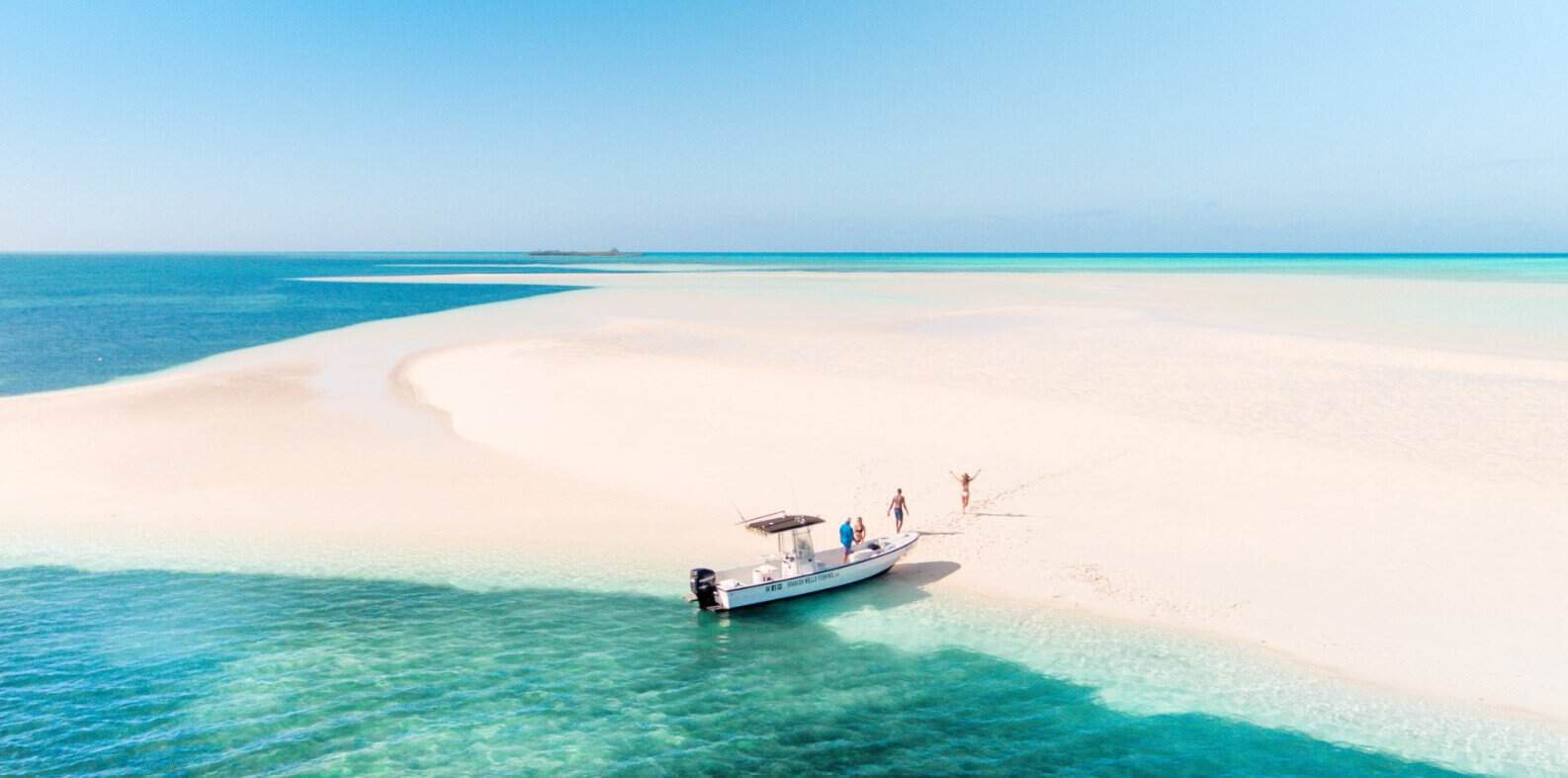 Bahamas - travel and tour world Travellers having fun by the beach