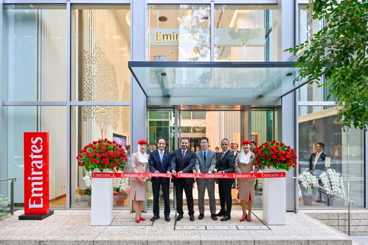 Emirates boosts japan travel as new tokyo store opens and more narita flights are set for october - travel and tour world Emirates representatives and cabin crew at a ribbon-cutting ceremony outside the airline’s tokyo travel store.