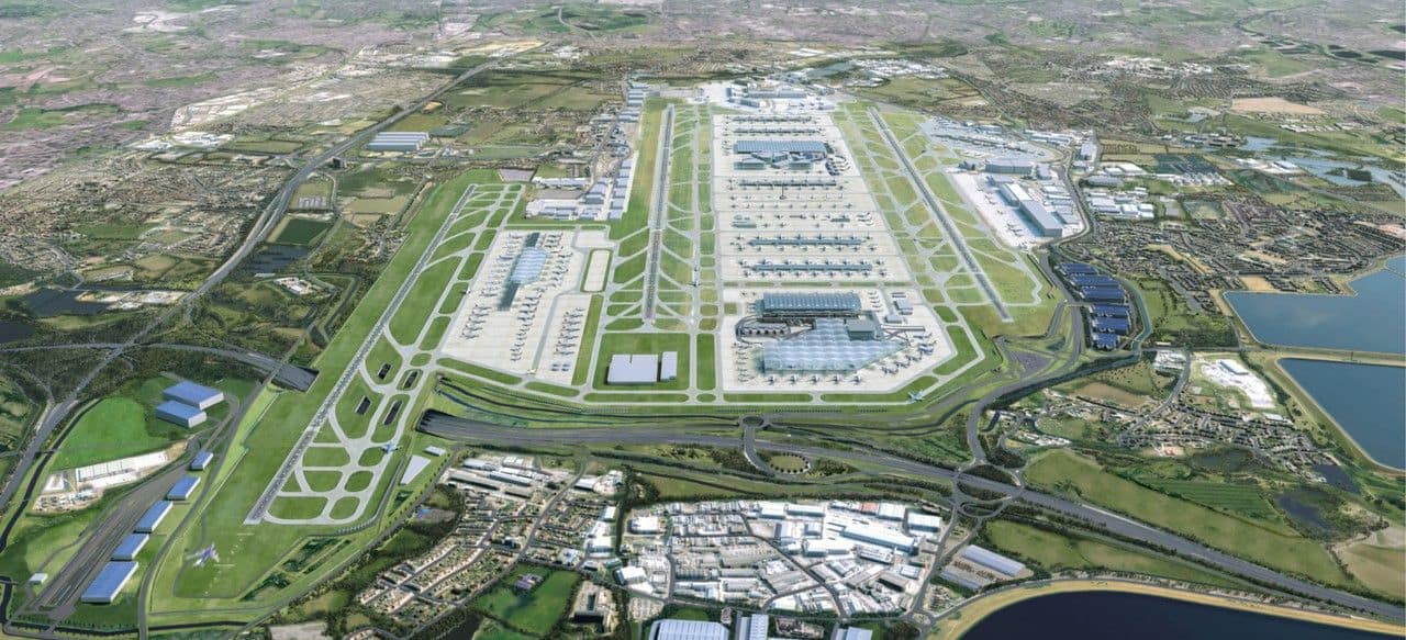Aerial view of heathrow airport showing runways, terminals, aircraft stands and surrounding infrastructure