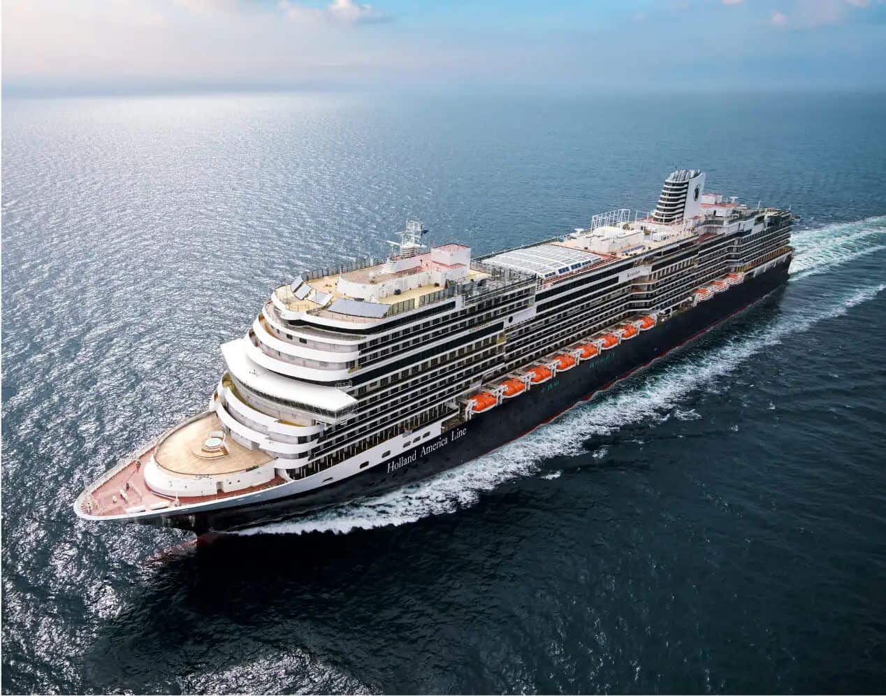 Holland america - travel and tour world Holland america line cruise ship sailing across the open ocean.