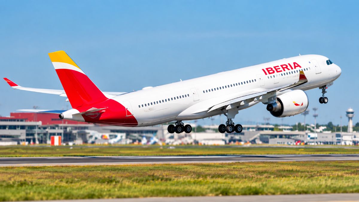 Iberia airliner lifting off - travel and tour world Commercial passenger jet on the airport tarmac at milan malpensa during passenger boarding procedures