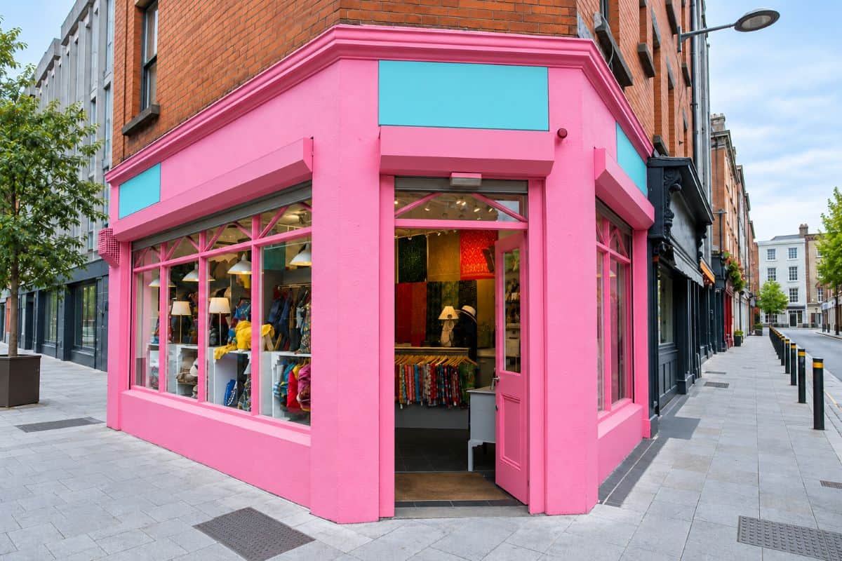 Pink corner shopfront and brick fa&ccedil;ades at clarendon street and chatham street in dublin.