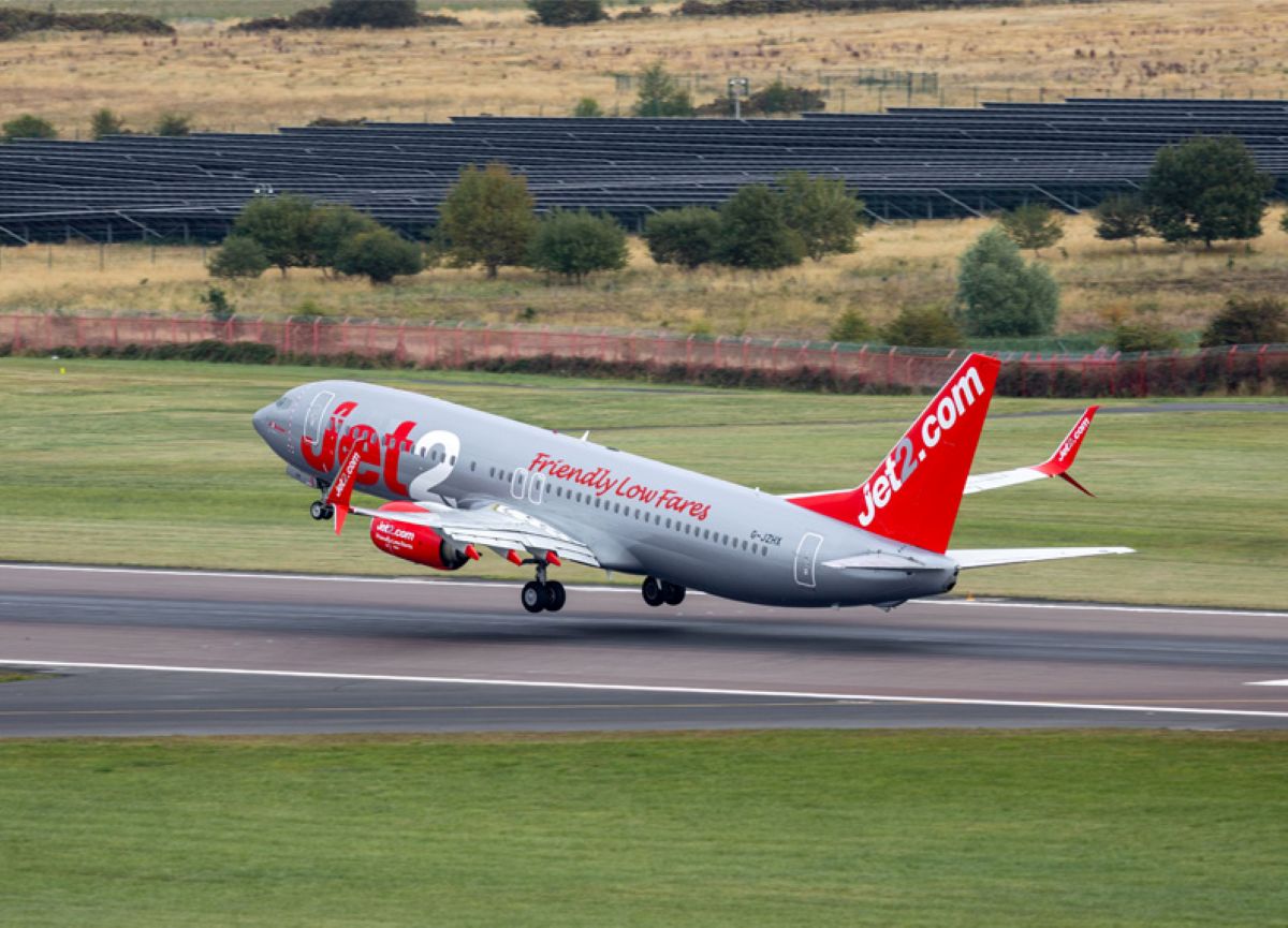 Jet 2 - travel and tour world Jet2 aircraft taking off from the runway at an airport.
