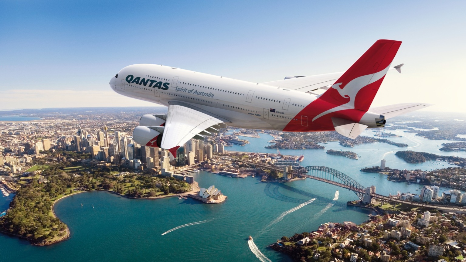 Qantas aircraft flying over sydney harbour as qantas frequent flyer offers up to 30% off points on australia domestic reward flights.