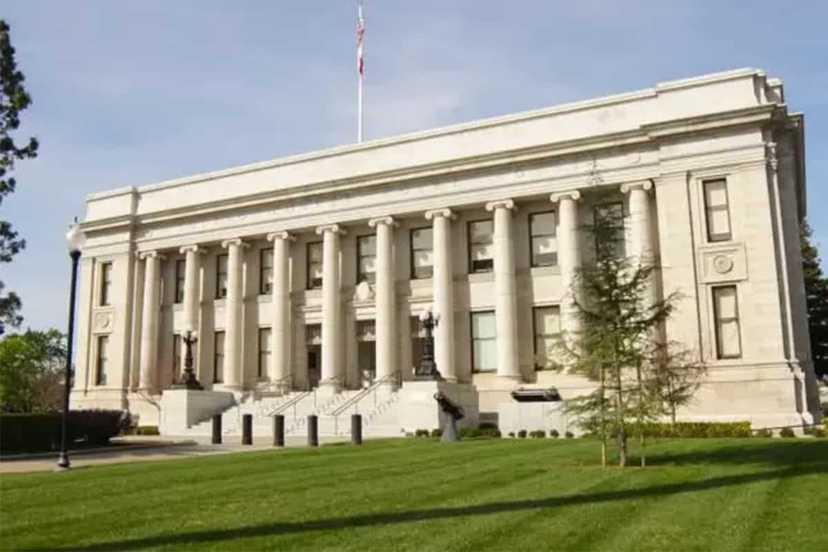 White building on a green field