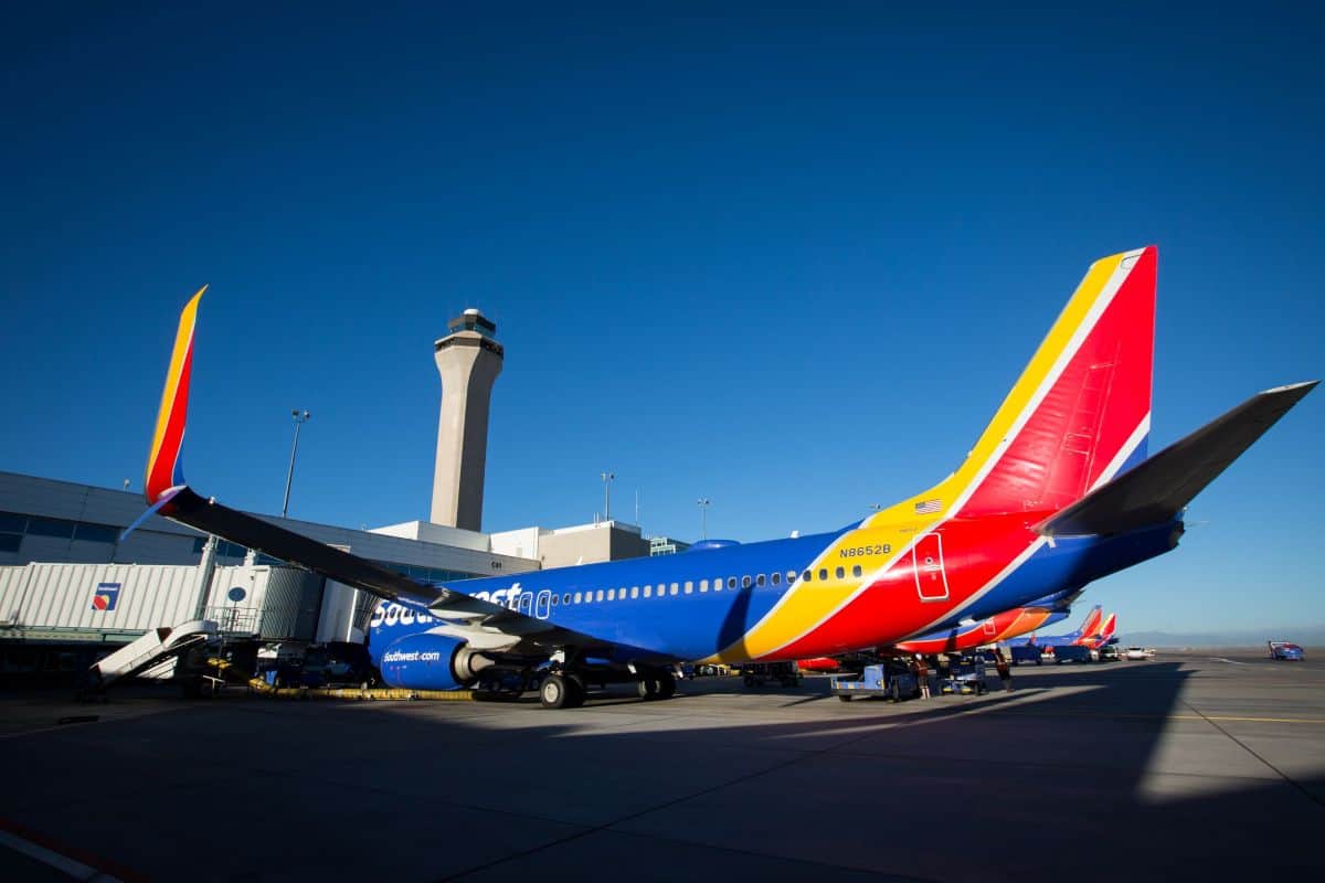 Swaexterior - travel and tour world Southwest airlines aircraft parked at airport gate.