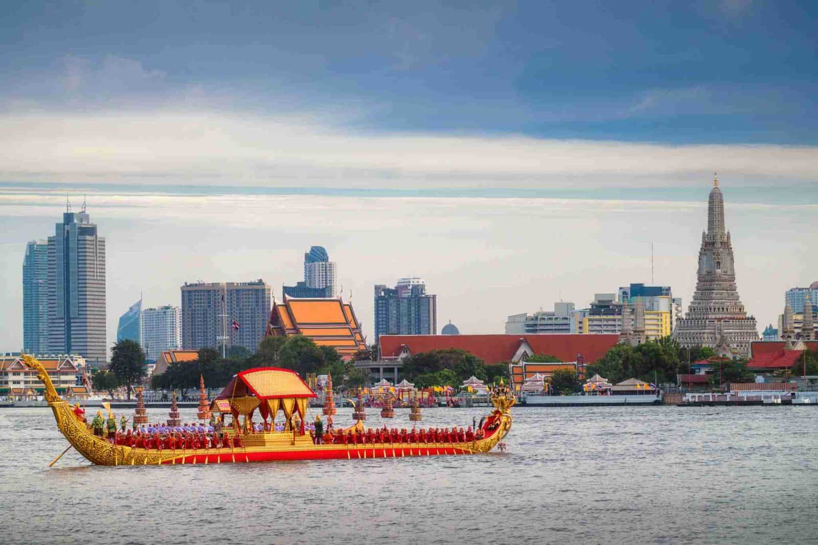 Thailand tourism - travel and tour world Passenger boats cruise along bangkok’s chao phraya river, offering affordable travel and access to thailand’s historic temples, cultural landmarks and riverside heritage districts.