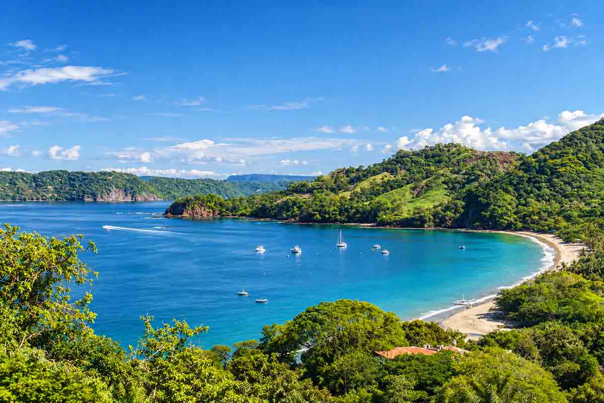 Turquoise-bay-among-lush-hills - travel and tour world Turquoise-bay-among-lush-hills