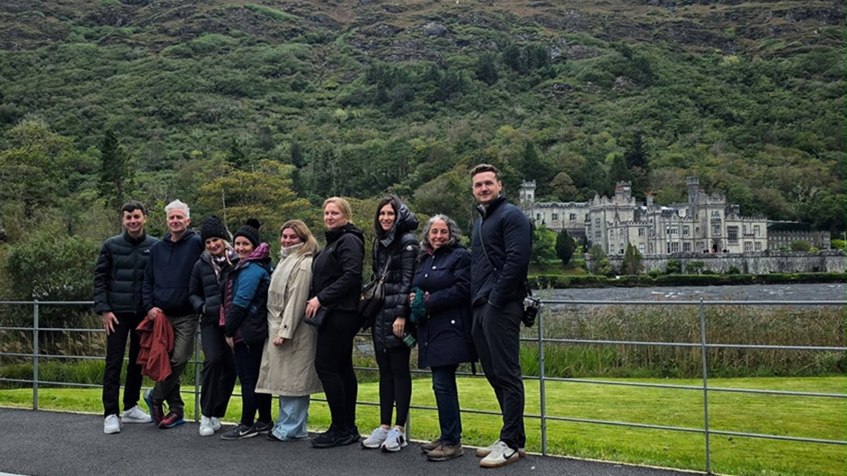 Australian-new-zealand-travel-agents-kylemore-abbey-galway-ireland-tourism-2027 - travel and tour world Australian and new zealand travel agents pose outside kylemore abbey in county galway, ireland.