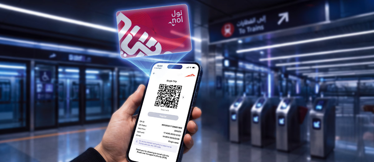Digital nol qr tickets - travel and tour world Passenger displaying a digital nol qr ticket on a smartphone beside a dubai metro gate reader.