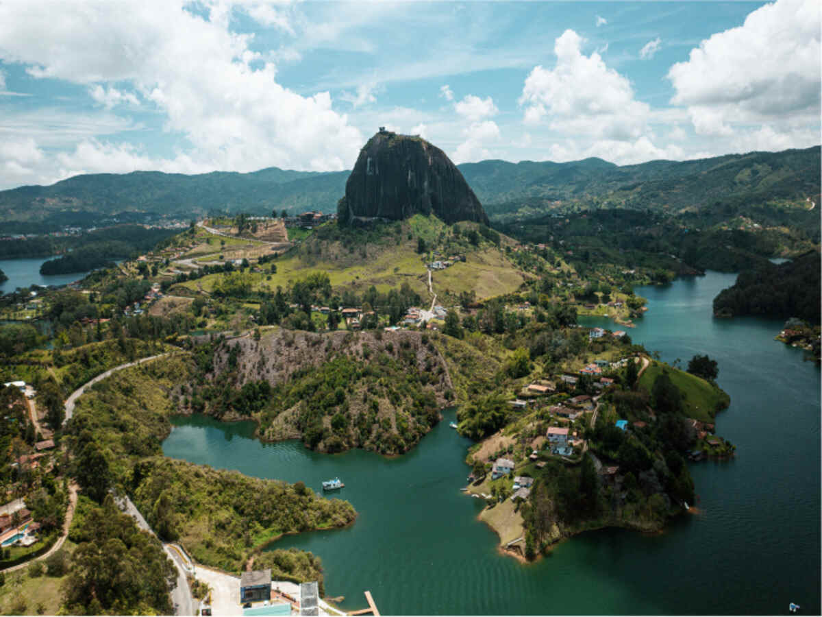 Guatapé rock and lake, colombia - travel and tour world Aerial view of el peñón de guatapé, surrounded by lakes and green hills in antioquia, colombia.