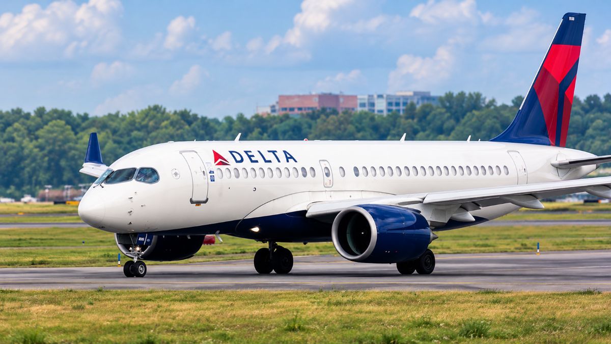 Delta air lines airbus a319 preparing to depart at salt lake city international airport, with several delta aircraft parked behind it. - travel and tour world Delta air lines