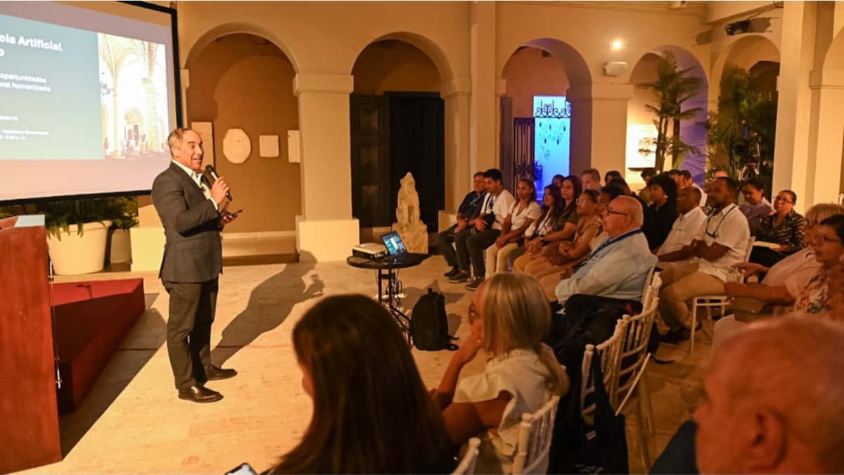 Speaker discusses ai in tourism with delegates at the 2026 dominican republic religious tourism congress.