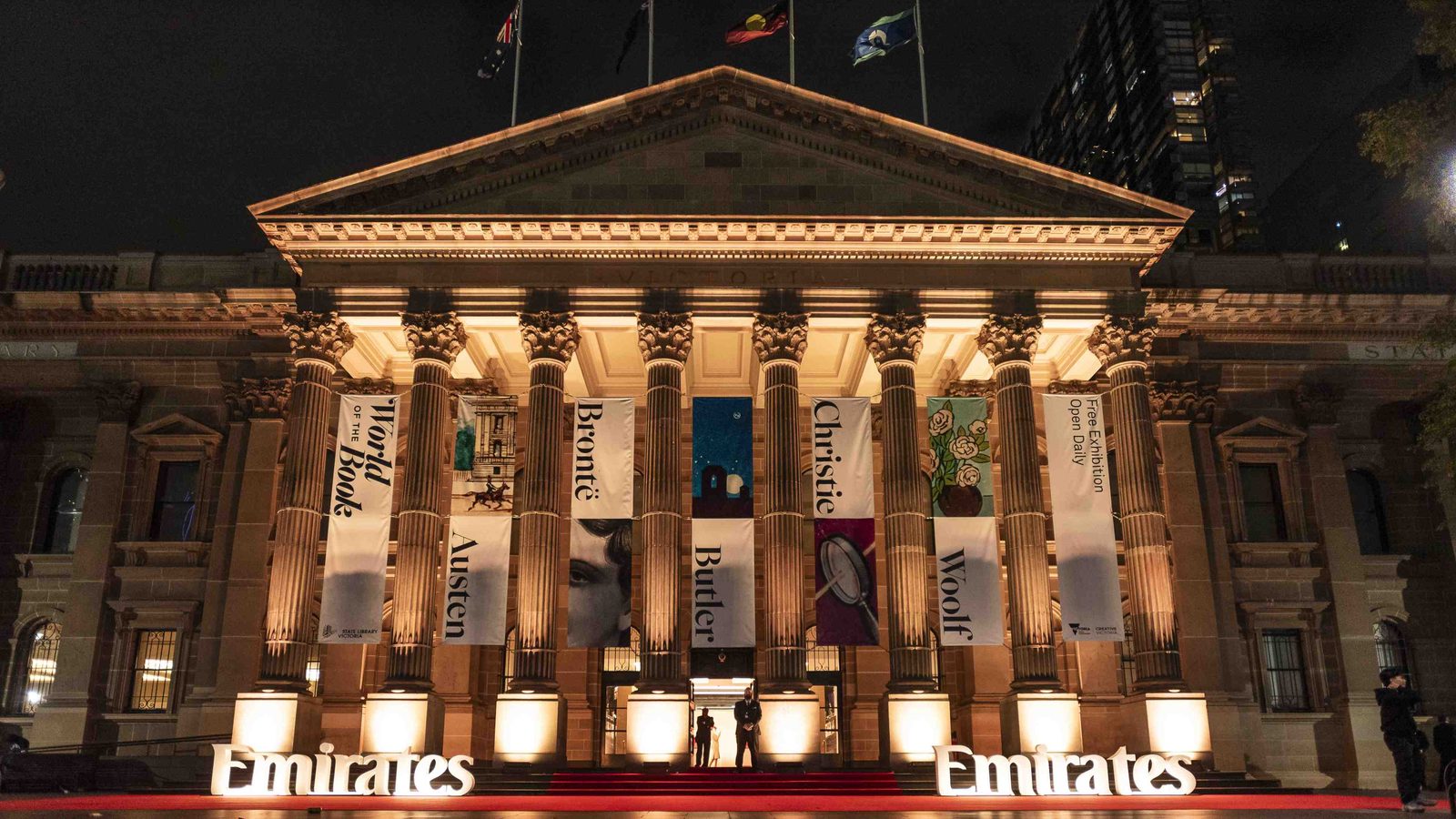 Emirates-australia-30th-anniversary-melbourne-state-library-celebration - travel and tour world Emirates 30th anniversary celebration at state library victoria in melbourne, featuring illuminated architecture and emirates branding.