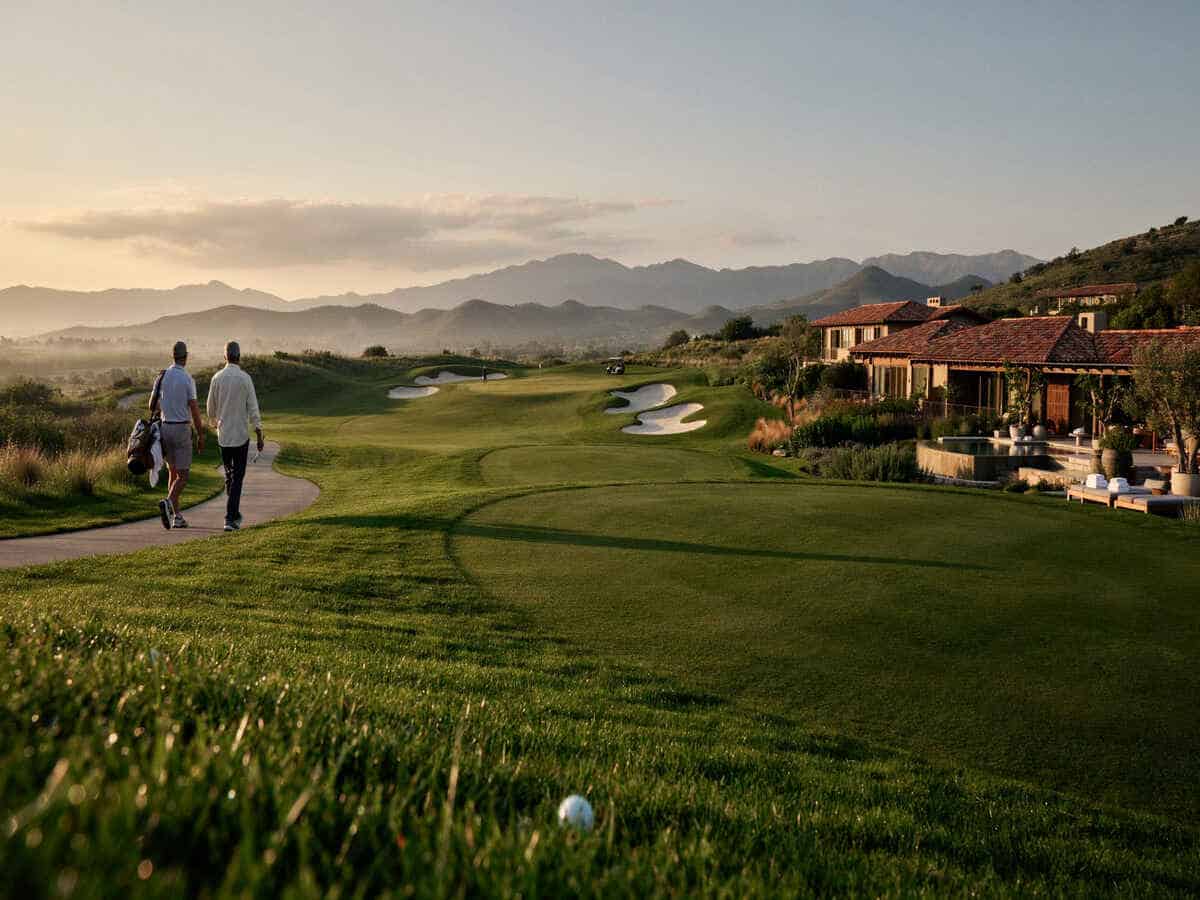 Global golf tourism growth 2026 - travel and tour world Uxury golf tourism resort with scenic fairways and golfers.