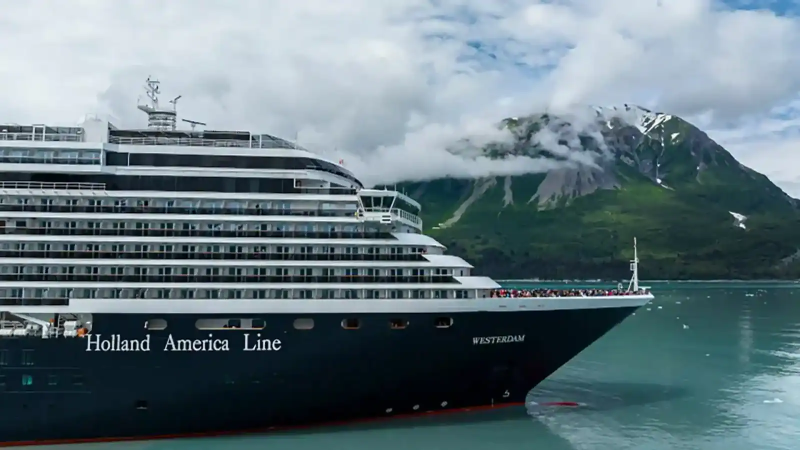 Holland-america - travel and tour world Holland america line oosterdam cruise ship sailing at sea ahead of its planned 2027 transformation and new itineraries.