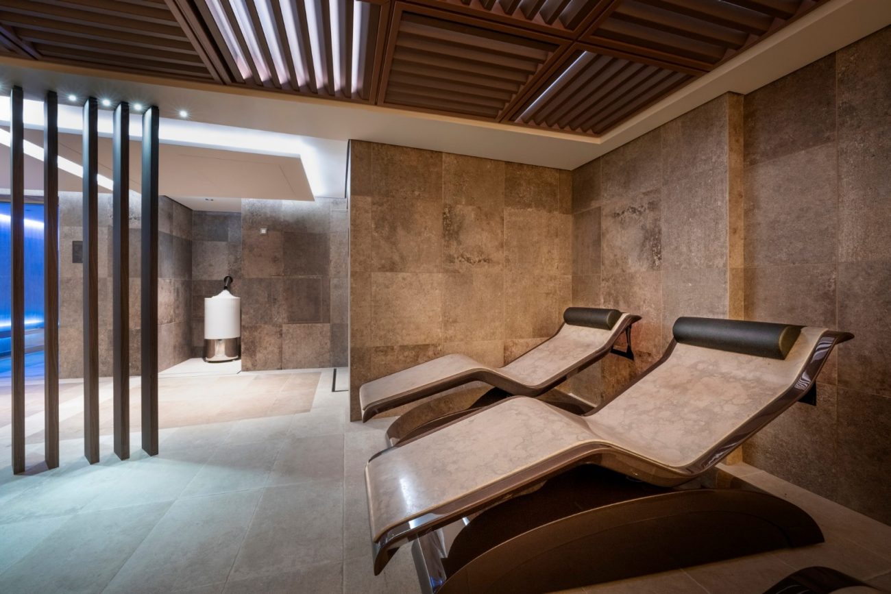 Isley paris luxury facial treatment suite inside ocean wellness &ndash; the spa aboard explora iii, featuring elegant treatment facilities and contemporary interiors.
