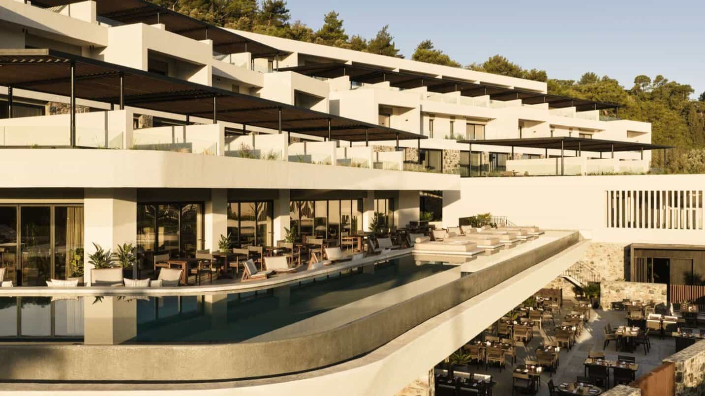 Nirema-hotel-spa-samos-accor-mgallery-luxury-hotel-pool - travel and tour world Nírema hotel & spa samos in greece featuring a luxury outdoor pool, modern terraces and open-air dining areas.