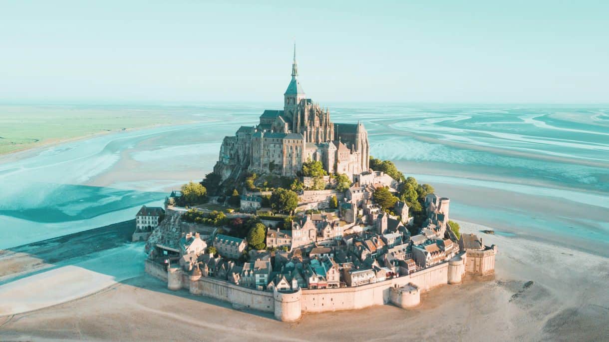 Aerial view of the majestic mont saint-michel in france - travel and tour world Aerial view of the majestic mont saint-michel in france