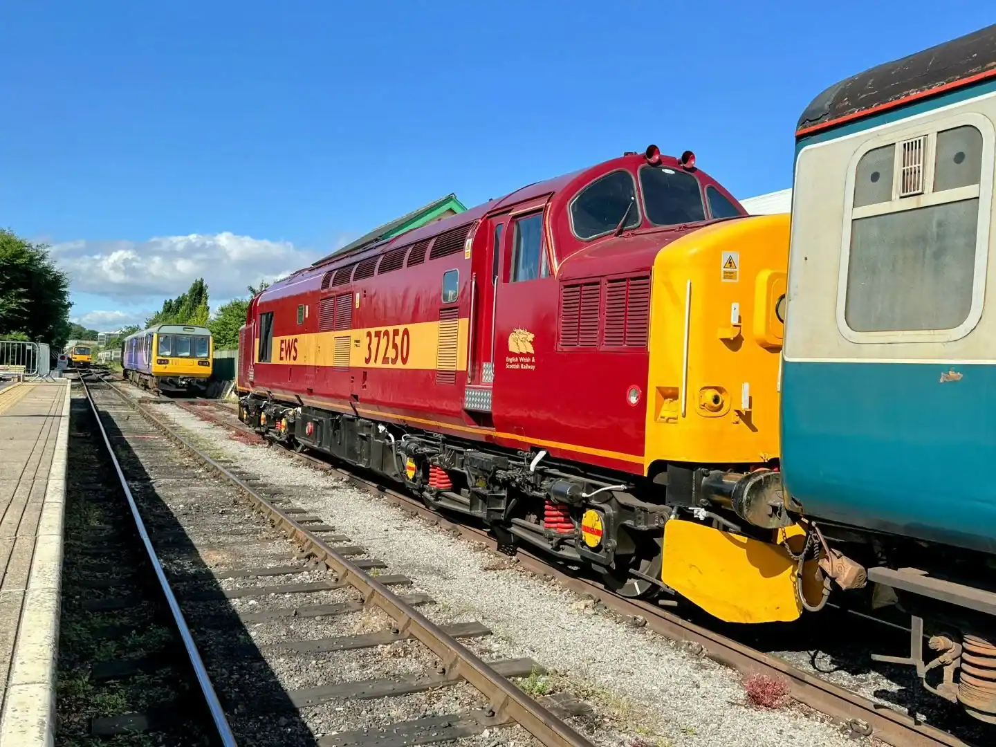 Wensleydale-railway - travel and tour world Wensleydale railway's restored class 142 pacer train, numbered 142060, featuring the nostalgic turquoise and lime-green northern spirit livery in north yorkshire, england.